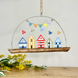 Coloured beach huts on stick