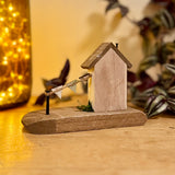 Wooden House With Flag Garland