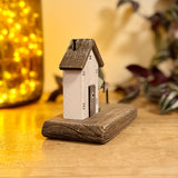Wooden House With Flag Garland