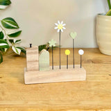 Green Wooden House with Flowers