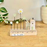 Green Wooden House with Flowers