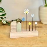 Blue Wooden House with Flowers