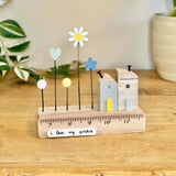 Blue Wooden House with Flowers