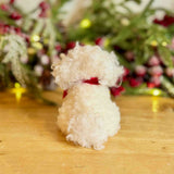 Fluffy White Dog with Red Bow