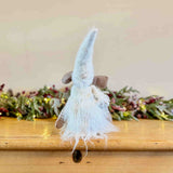Sitting Brown Mouse in White Winter Dress