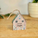 Hanging ‘Keep Life Simple’ House