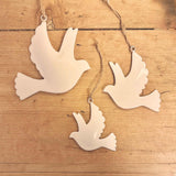 Trio of White Metal Doves